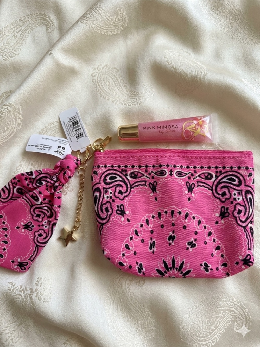 Pink Bandana Print Wristlet Pouch with Star Charm and lip gloss